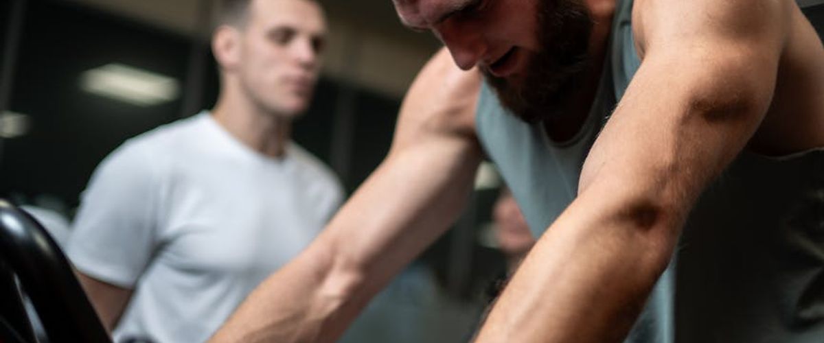 Group of men training in a spacious modern gym